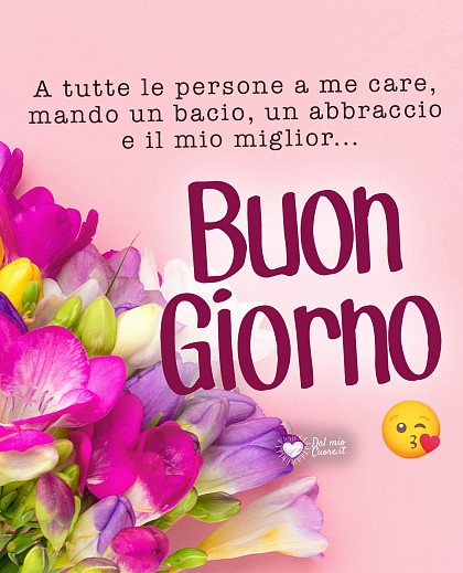 Mazzo rigoglioso di fiori colorati con rose e margherite accompagnato dalla dedica A tutte le persone a me care, mando un bacio, un abbraccio e il mio miglior... Buongiorno.